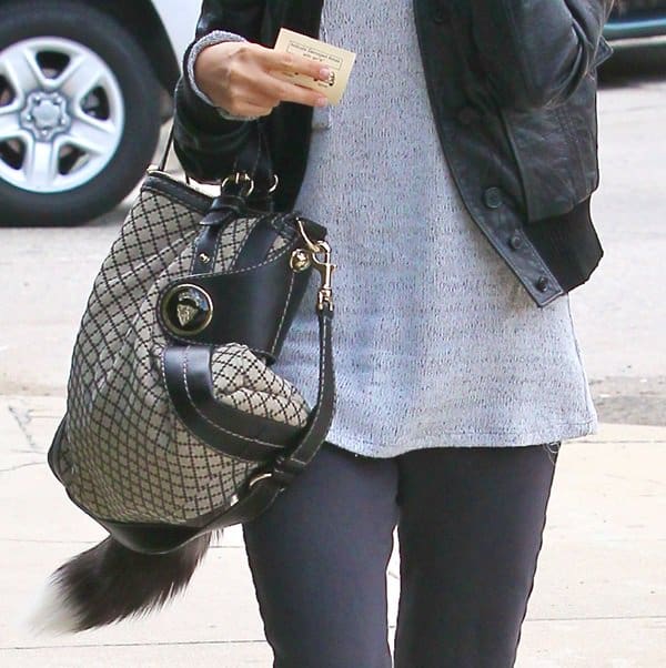 Ashley Tisdale carries the sophisticated Gucci Crest Boule Diamante tote with confidence