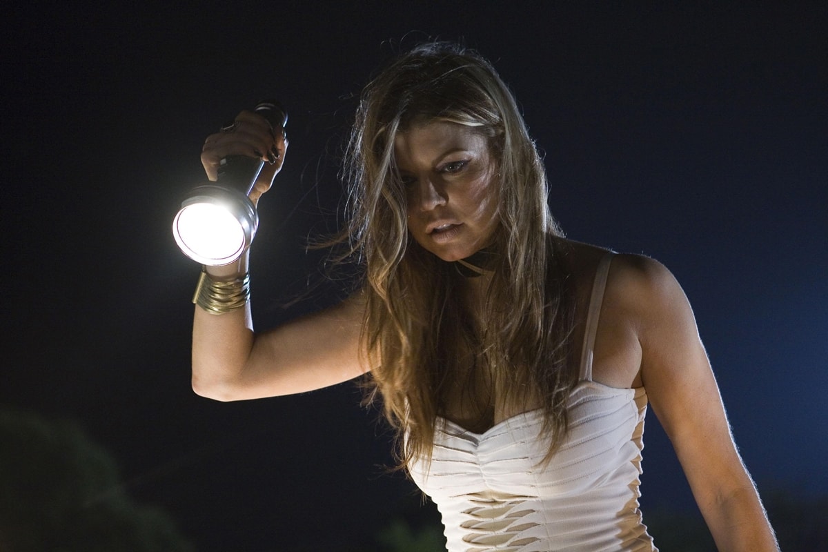 Fergie as Tammy Visan holding a flashlight before being killed in Grindhouse