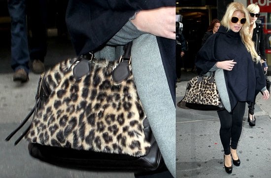 Jessica Simpson steps out of Bergdorf Goodman in New York City on October 24, 2011, showcasing Celine's Triptyque leopard-print calf hair bag, highlighting the trend's allure among celebrities