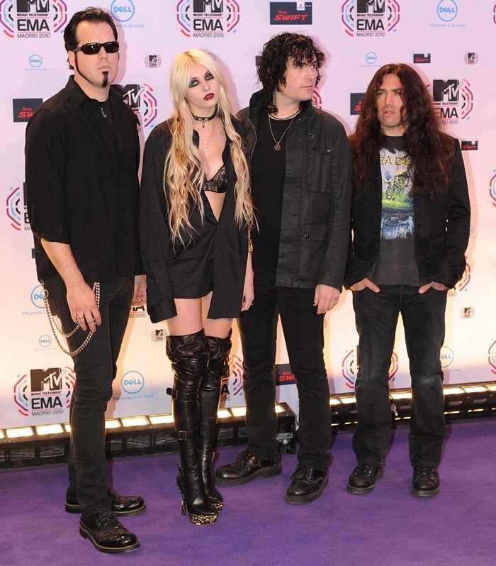 Taylor Momsen and The Pretty Reckless pose in front of the media boards at the MTV Europe Music Awards 2010 at La Caja Magica on November 7, 2010 in Madrid, Spain