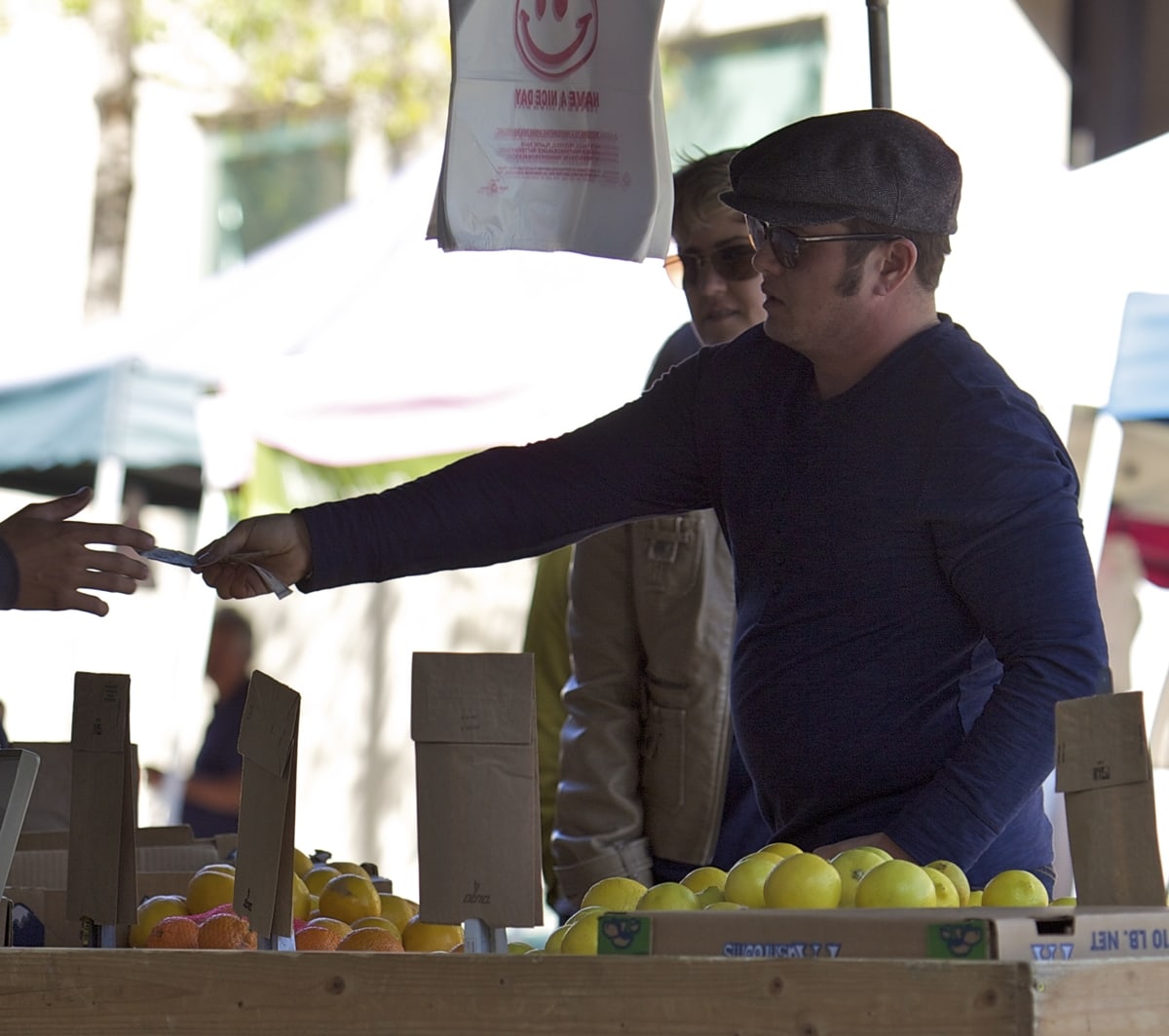 Chaz Bono buys healthy fruits and vegetables from a local farmers market