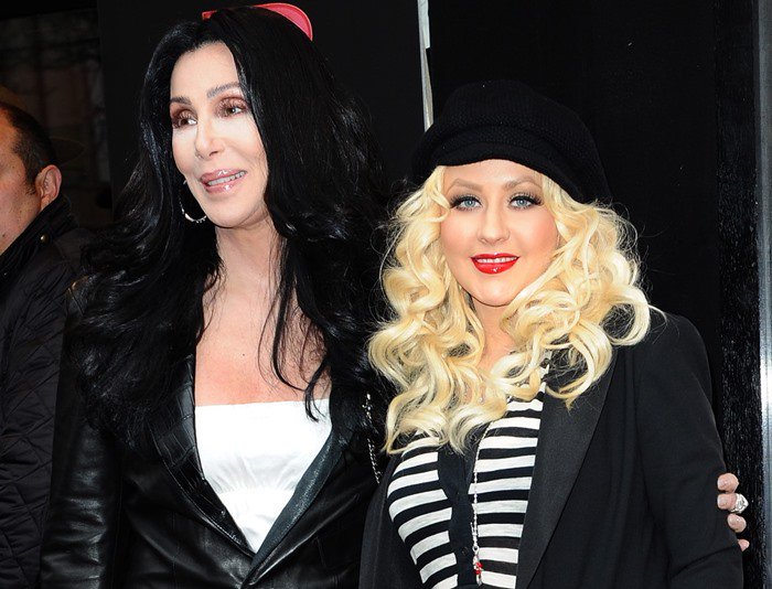 The height difference between Christina Aguilera and Cher is approximately 4 inches (10.2 cm), with Aguilera standing at 5 feet 1 ½ inches (156.2 cm) and Cher at 5 feet 5 ½ inches (166.4 cm)