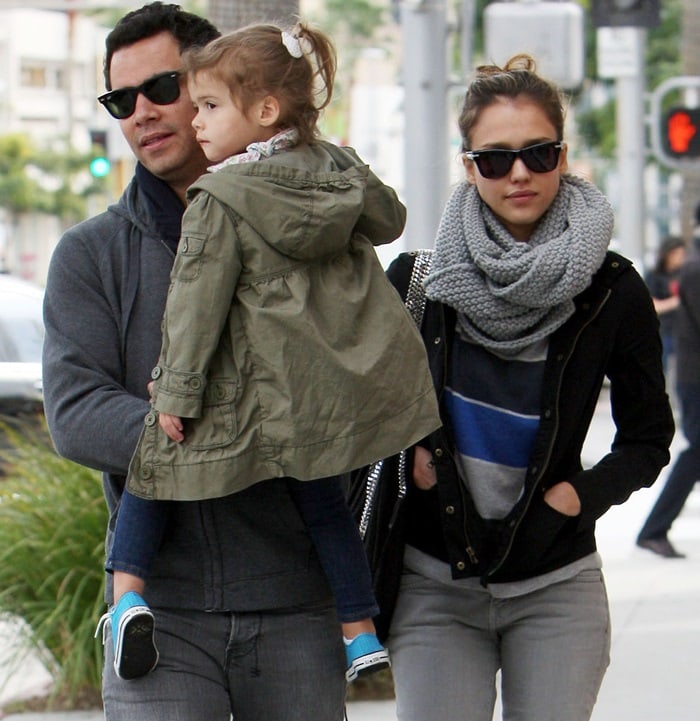 Jessica Alba's style seamlessly blends casual comfort with a touch of glamour, exemplified by her distinctive hobo bag