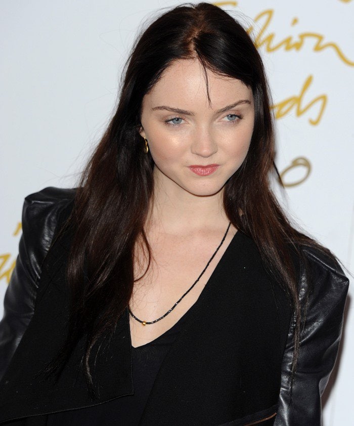 Lily Cole throws a sultry look in an all-black look from the red carpet