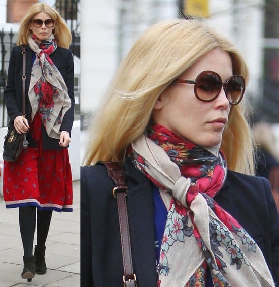 Elegant in her Style: Claudia Schiffer showcases a chic printed silk scarf complementing her casual ensemble, captured after a morning school run in London, January 31, 2011