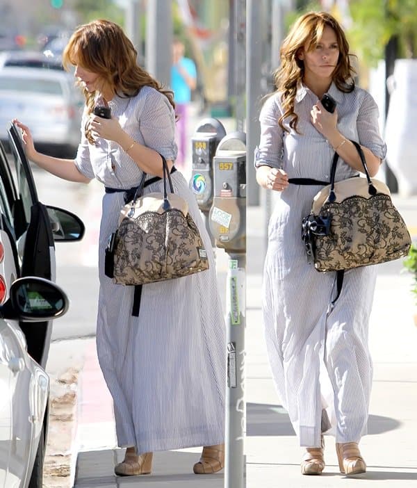 Jennifer Love Hewitt keeps it effortlessly chic in a striped maxi dress, paired with nude wedges and her signature Valentino Nuage lace and straw top handle bag while out and about in Los Angeles