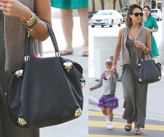 Strolling through Beverly Hills: Jessica Alba elegantly accessorizes with her Viktor & Rolf handbag alongside daughter Honor Marie, January 15, 2011