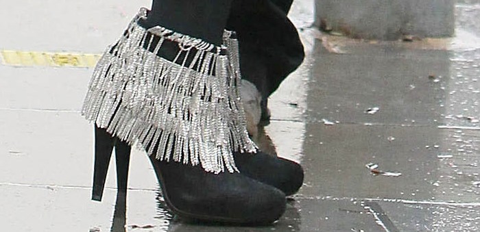 Kylie Minogue turns heads in London, sporting a pair of statement-making, chain-embellished ankle boots from Roberto Cavalli