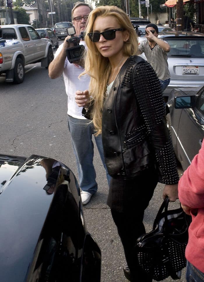 Lindsay Lohan in Los Feliz with her Burberry studded metallic leather bowling bag on January 7, 2011