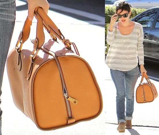 Rachel Bilson rocks a scoop neck shirt while toting Chloé's Aurore leather duffle bag