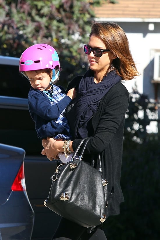 A day at the bike shop: Jessica Alba pairs her casual style with her signature Viktor & Rolf handbag while accompanying daughter Honor in Santa Monica, January 12, 2011