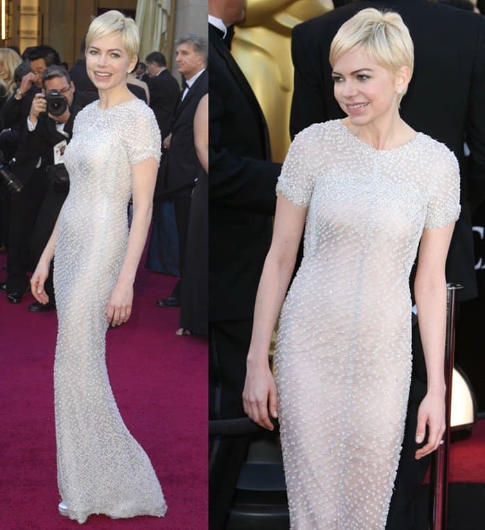 Michelle Williams attends the 2011 Oscars wearing an embellished Chanel Couture gown.