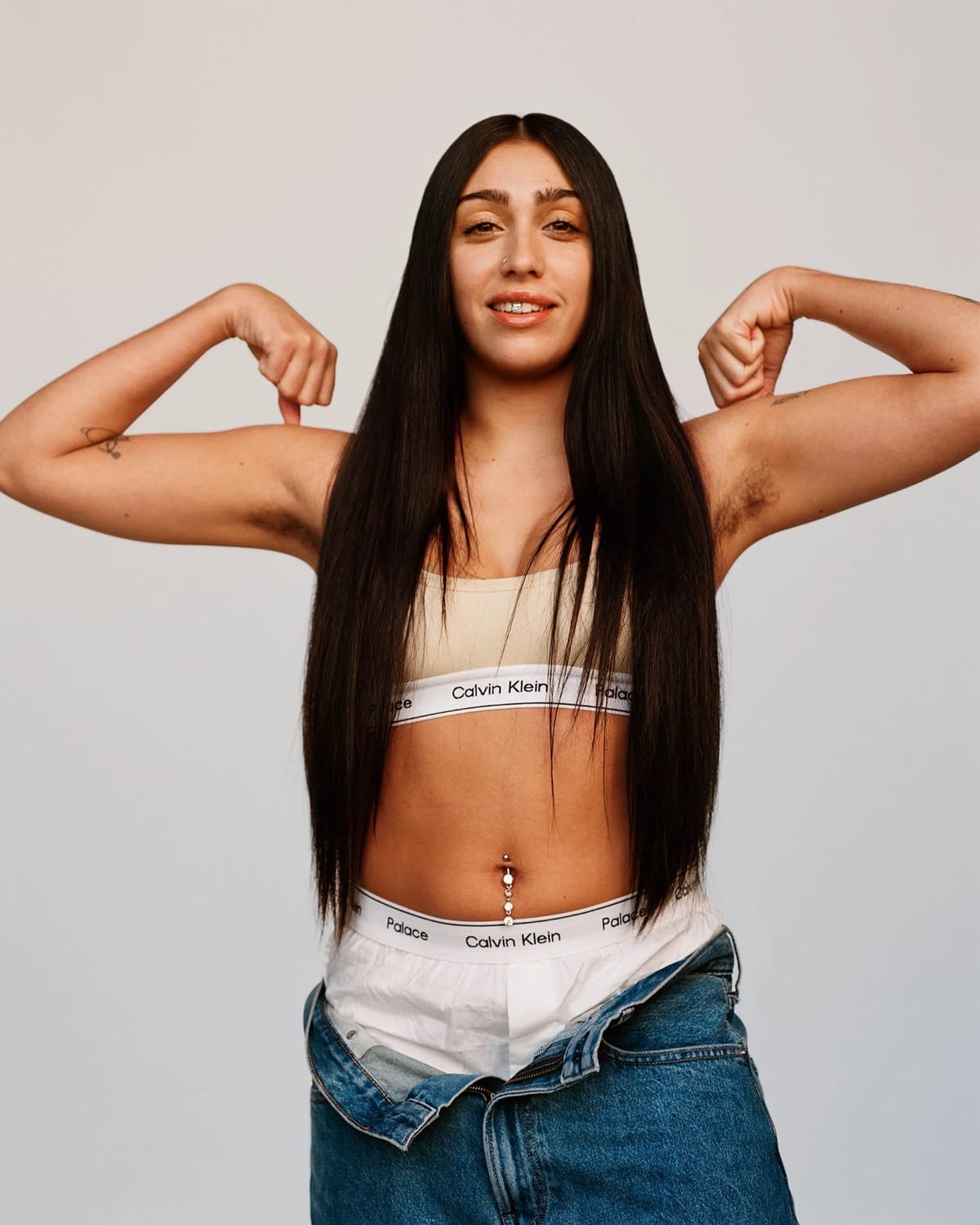 Lourdes Leon tries to normalize visible body hair while flexing her muscles in jeans and Calvin Klein underwear