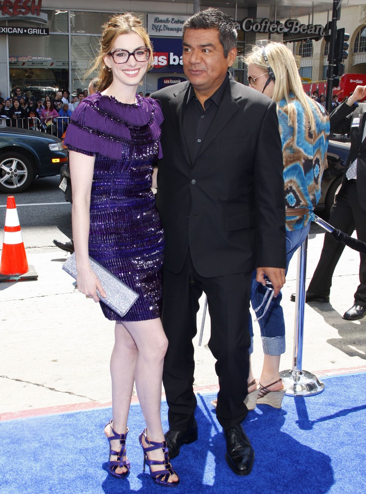 Anne Hathaway and George Lopez arrive for the premiere of Twentieth Century Fox & Blue Sky Studios' "RIO"