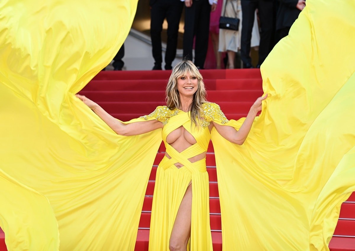 Despite a wardrobe incident where a subtle glimpse of her nipple became visible from the golden bodice, Heidi Klum remained composed and confident during her red carpet appearance at the Cannes Film Festival