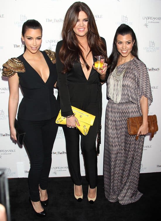 Kim Kardashian, Khloe Kardashian, and Kourtney Kardashian attend the launch of "Unbreakable" on April 4, 2011, in Hollywood, California