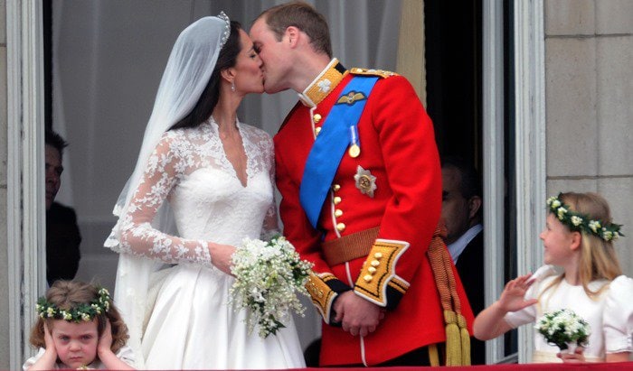 Prince William and Catherine Middleton kiss on the balcony at Buckingham Palace in London on April 29, 2011