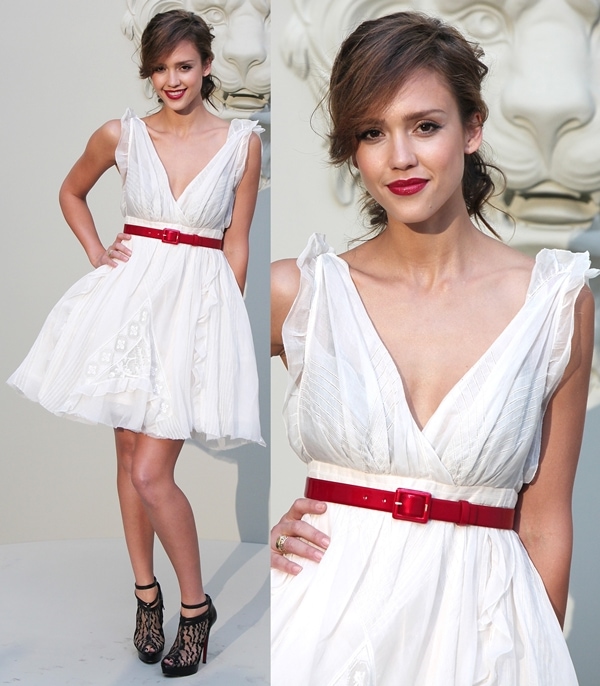 Jessica Alba radiates elegance at Paris Fashion Week Haute Couture Autumn/Winter 2010/11, pairing a flowing white dress cinched with a bold red belt and intricate black lace heels for a striking contrast at the Chanel Fashion Show in Paris on July 6, 2010
