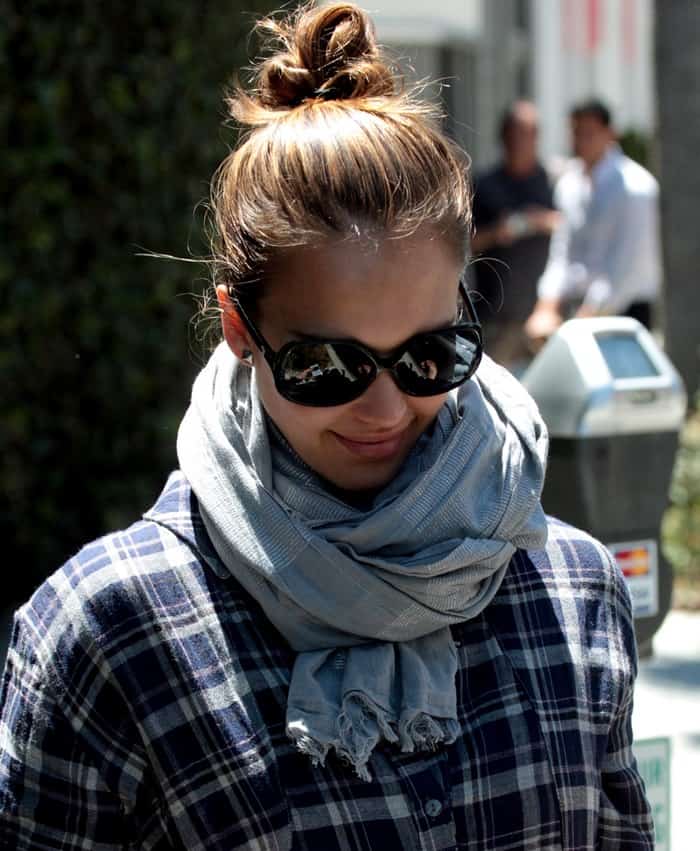 Jessica Alba stylishly accessorizes with a scarf while showcasing her baby bump, exiting Barneys New York in Beverly Hills on April 26, 2011