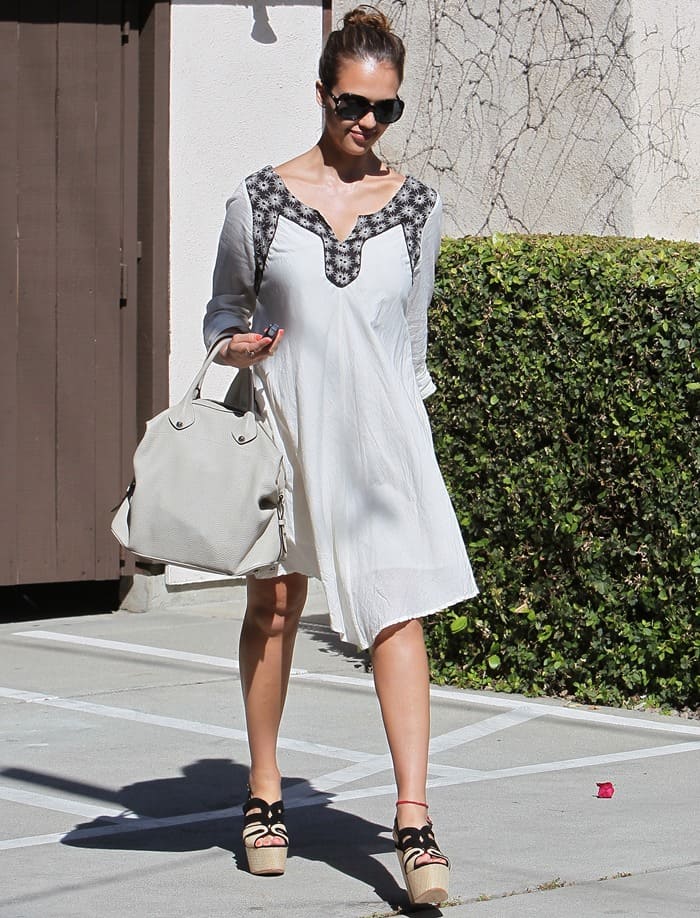 Jessica Alba in a white dress, leaving Chez Marie post-celebration in Los Angeles on April 28, 2011