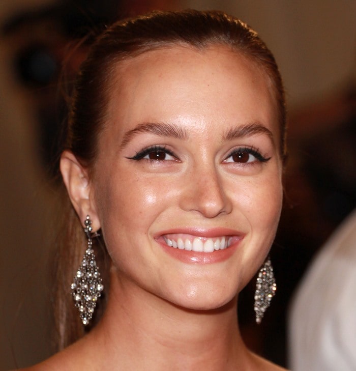Leighton Meester shines with a radiant smile, sleek pulled-back hair, luminous dewy makeup, and dazzling Cathy Waterman diamond mesh earrings that add the perfect touch of elegance