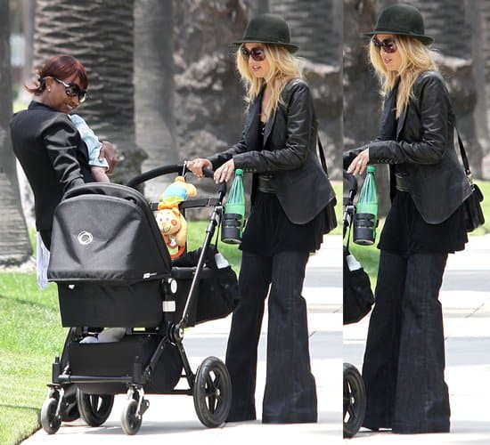 Rachel Zoe, balancing motherhood and fashion, strolls with her son Skyler in Beverly Hills, still favoring her J Brand maternity jeans, on May 23, 2011