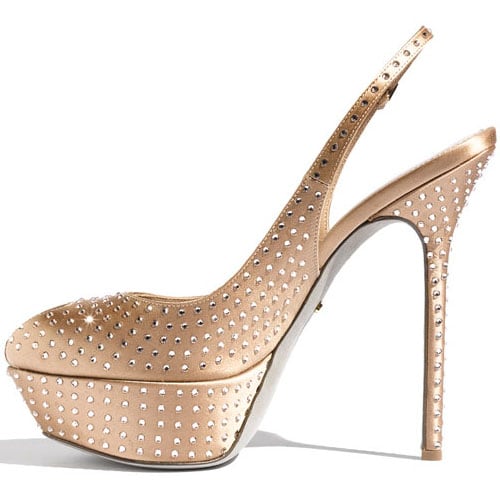 Sparkling Swarovski crystals dot a high-sheen satin slingback with a beguiling peep toe