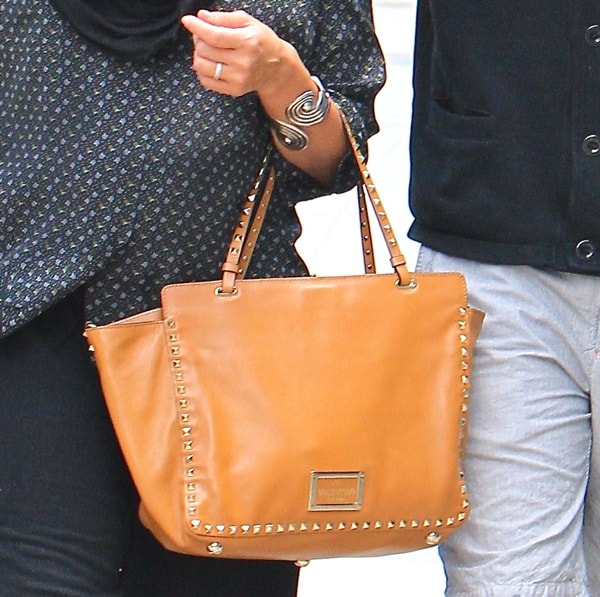 Close-up view of Jessica Alba's Valentino 'Rockstud' leather shoulder bag, showcasing its elegant studs and handles