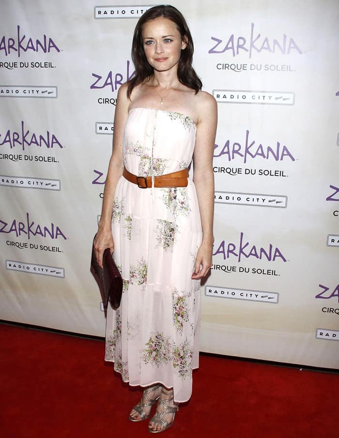Alexis Bledel graces the 'Zarkana' by Cirque du Soleil premiere at Radio City with effortless charm, donning a breezy floral print maxi that whispers of summer nights