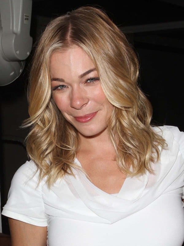 Turning Heads: LeAnn Rimes makes a bold statement in a chic white cutout dress, showcasing her slender silhouette