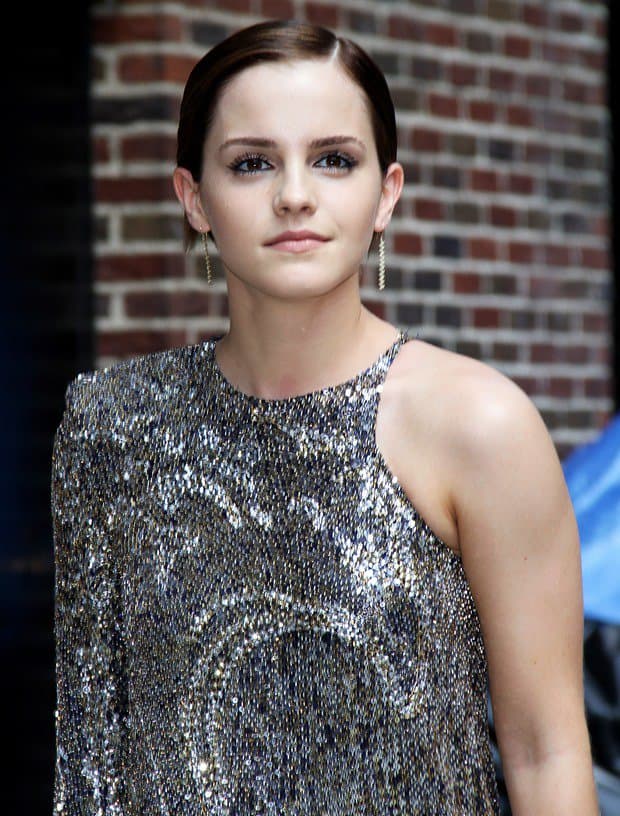 Emma Watson sports the distinctive Balmain Fall 2011 one-sleeved silver dress outside the Ed Sullivan Theater for a guest appearance on 'The Late Show with David Letterman' in New York City on July 11, 2011