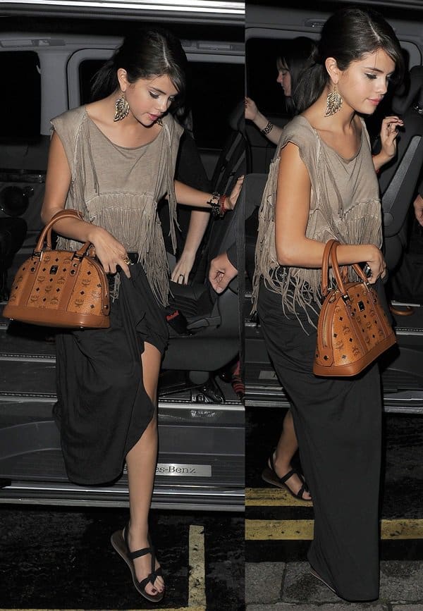 Selena Gomez looking boho chic in a fringe-detailed blouse and a maxi skirt