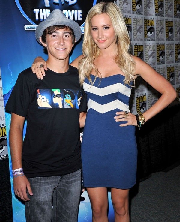 Ashley Tisdale appeared taller than Vincent Martella at Comic-Con, thanks to her nude peep-toe platform heels that added extra height to her blue and white strapless dress look
