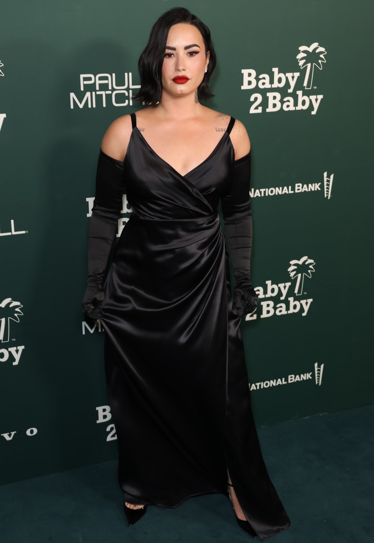 Demi Lovato wowed in a black Dolce & Gabbana gown with matching opera gloves at the 2023 Baby2Baby Gala Presented By Paul Mitchell in West Hollywood, California, on November 11, 2023
