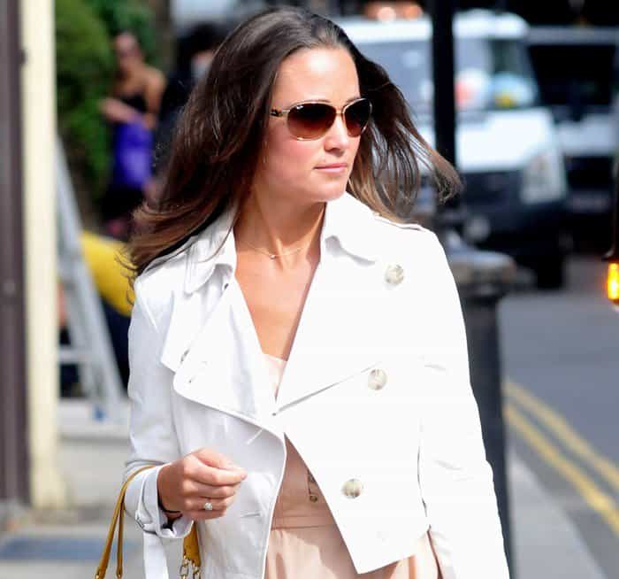 Pippa Middleton spotted in London, elegantly dressed in a blush-colored maxi with a white jacket while running errands