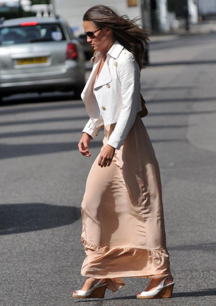 Pippa Middleton in London on August 22, 2011, wearing a Twelfth Street by Cynthia Vincent ruffle hem maxi dress in blush, Ri2k Portobello bag in ochre, L.K.Bennett Rosie patent leather cork wedge sandals, and Ray Ban 3386 gold matte brown gradient sunglasses