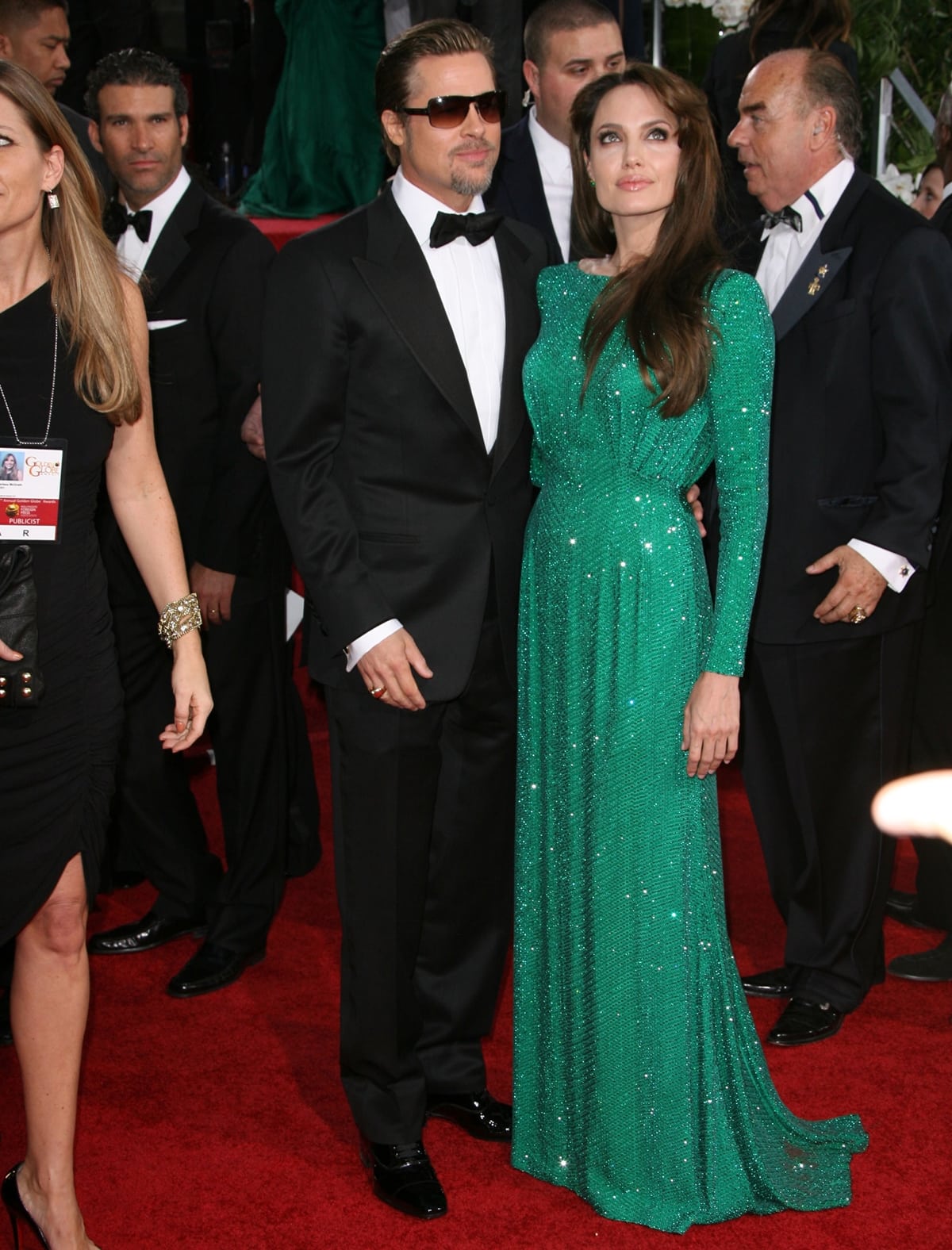 Angelina Jolie in an emerald green Atelier Versace gown with Brad Pitt in a Tom Ford tuxedo at the 68th Annual Golden Globe Awards