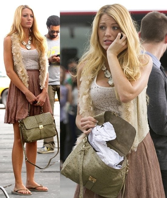 Blake Lively wearing a geometric print white tank top, a slightly wrinkled lavender pleated skirt, and a champagne-colored sequin vest with feather trim