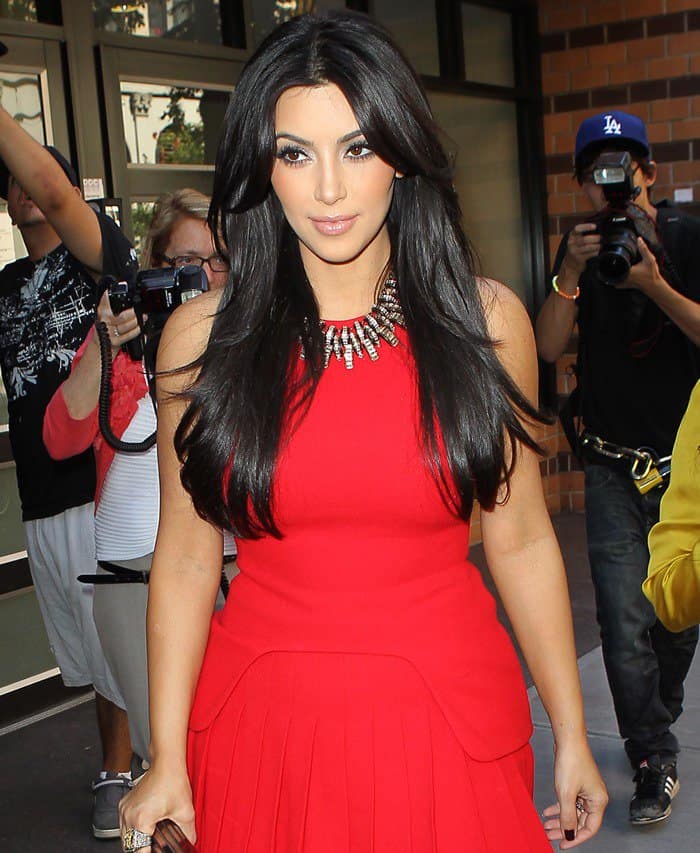 Kim Kardashian captures attention in Manhattan, filming 'Kourtney & Kim Take New York' in a stunning red dress, August 30, 2011