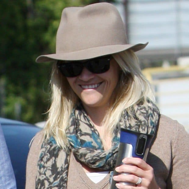 A look at Reese Witherspoon wearing a printed scarf, contributing to her chic western-inspired style