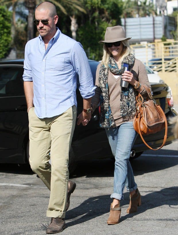 Reese Witherspoon, accompanied by her husband Jim Toth, was seen leaving church on September 18, 2011, stylishly dressed in Ray-Ban Original Wayfarer RB2140 sunglasses, a Rolex Day Date Presidential wristwatch, a Chloé Paraty python and leather bag, and Rag & Bone Harrow leather ankle boots