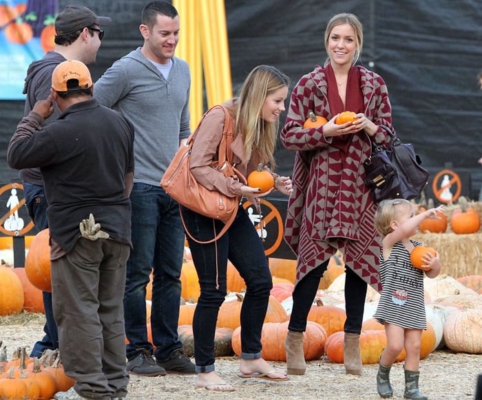 Captured on October 19, 2011, Kristin Cavallari radiates fall vibes while selecting pumpkins at the renowned Mr. Bones Pumpkin Patch in West Hollywood, California