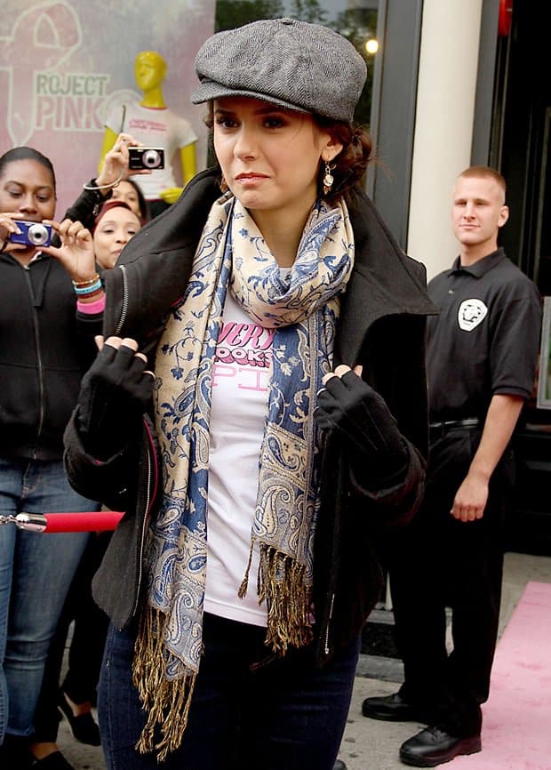 Nina Dobrev looked oh-so-chic in her biker jacket and paisley-printed scarf