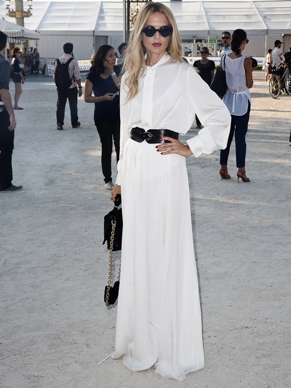 Captured in elegance, Rachel Zoe attends the Christian Dior show during Paris Fashion Week, showcasing the power of a white maxi skirt and her unparalleled sense of style