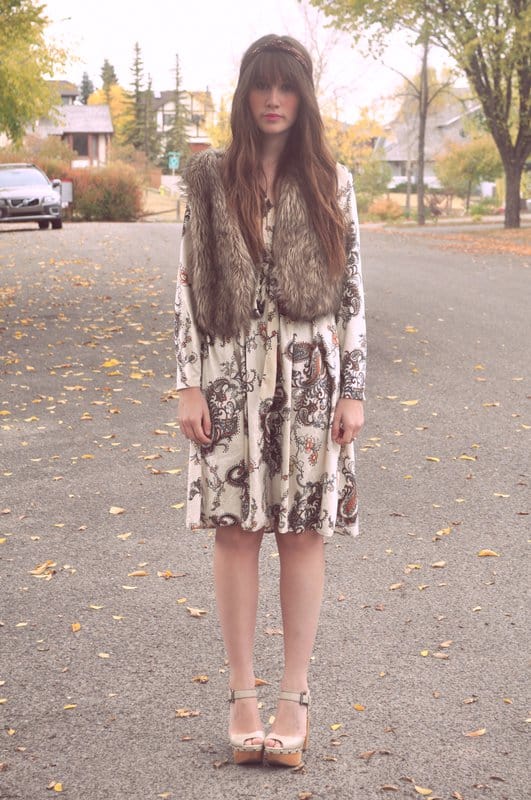 Amy Nelson, the poetic fashion blogger behind Amy Flying A Kite, pairs a vintage-inspired paisley dress with platform ankle-strap heels and a faux fur vest for a dreamy, bohemian fall look