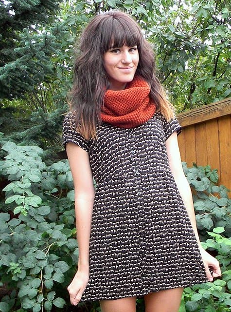 Tonya Smith of The Moptop adds a pop of color to her printed mini dress with a bold rust infinity scarf