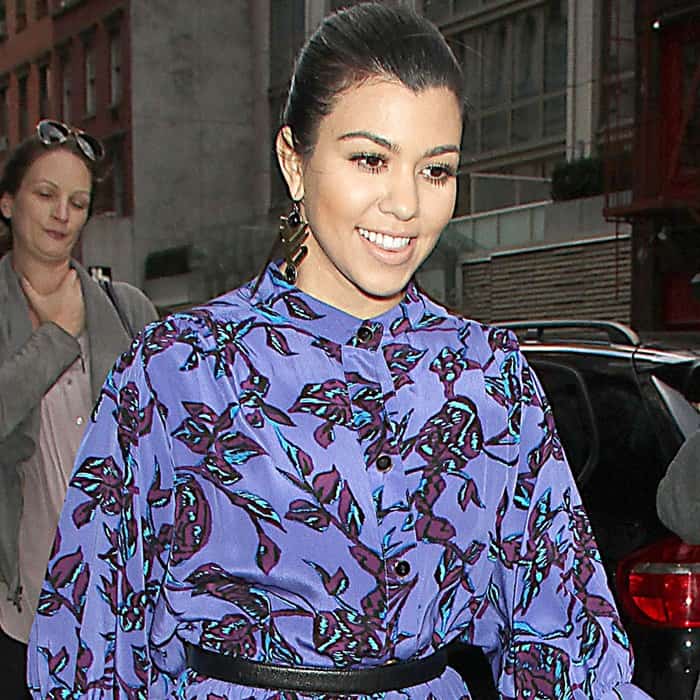 Kourtney Kardashian in a striking blue, Japanese-inspired Sunner dress, captured in New York City