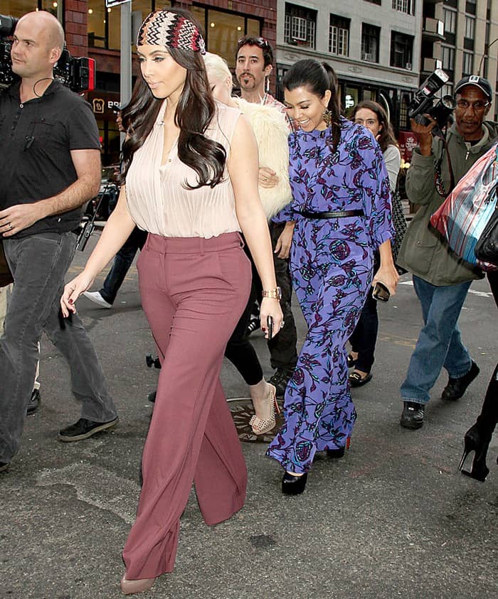 On her outing in New York on October 20, 2011, Kourtney Kardashian looked chic in a Sunner Remo dress, paired with Christian Louboutin Daffodile platform pumps, accessorized with Nissa Jewelry Kachira earrings and the classic Cartier Love bracelet