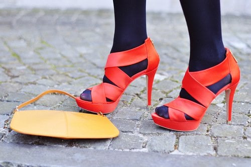Kristina Bazan styled her black stockings with red heels
