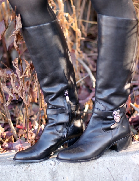 Vickie's black riding boots from Micheal Kors